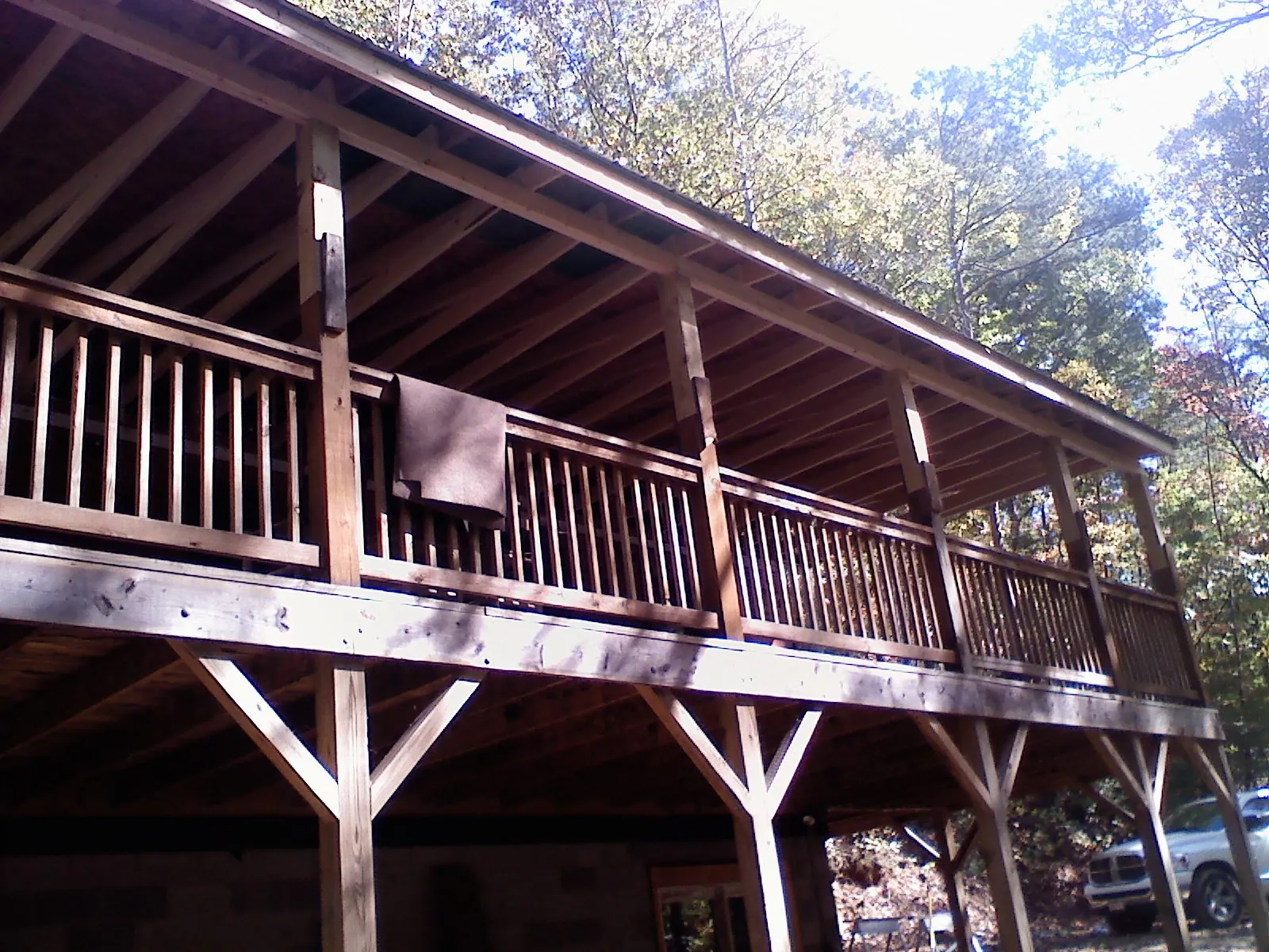 Timber framing under a new elevated porch and deck — Roof Leak Repair in Coopersville by Roofing Brothers