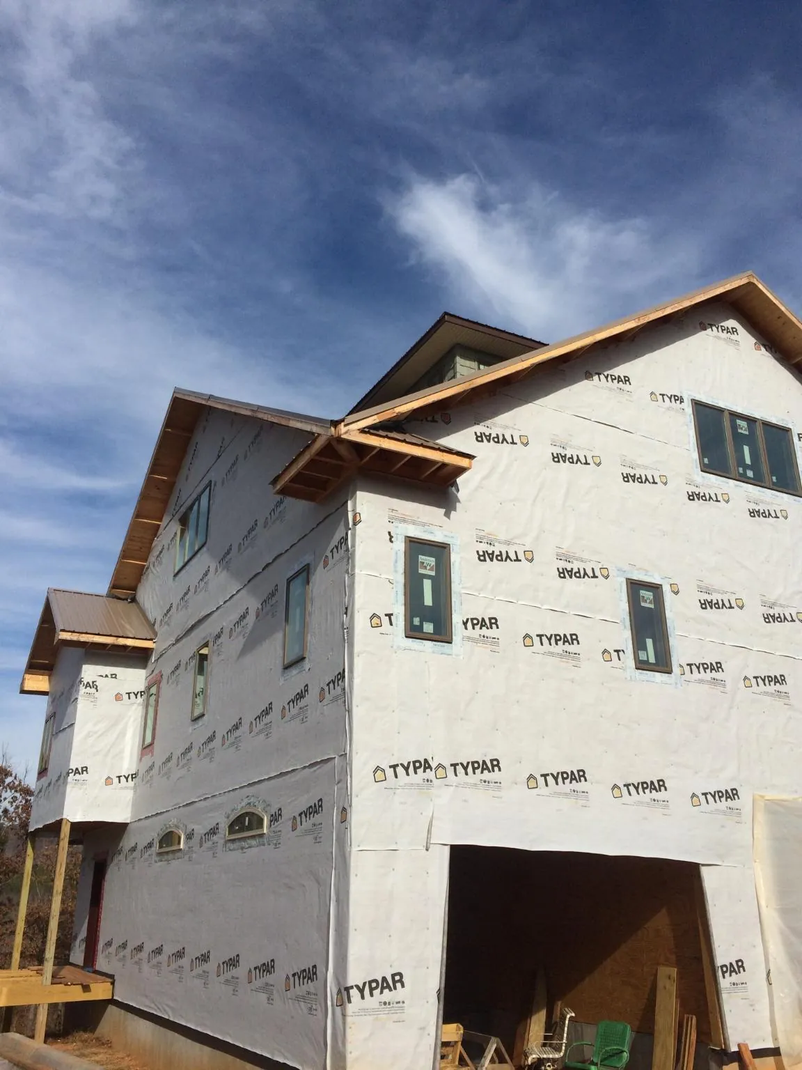 Stick built house wrapped in Typar with new roof framing and dormers in Coopersville